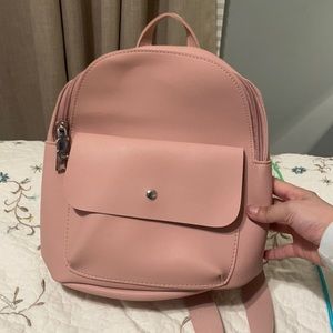 This is a pink bag used no rip but do have some stains that can be removed.